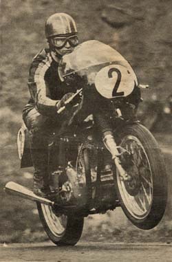 Mick Andrew on the Gus Kuhn Norton leaps up the mountain at Cadwell Park.